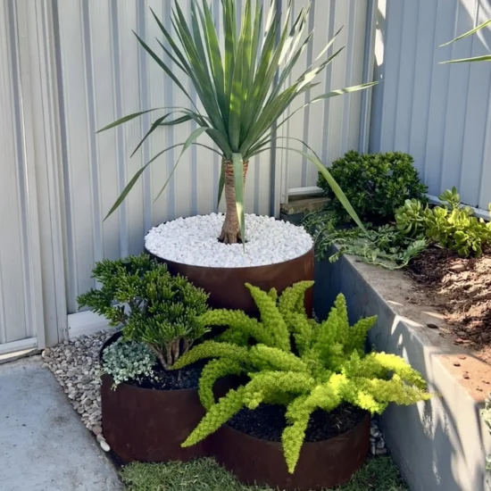 3 Layer Round Corten Steel Planter Box Design Idea with Plants in Burleigh Heads Gold Coast Region by Metwall